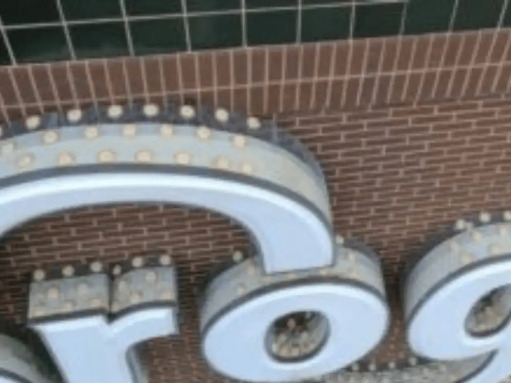Optical Gel™ dishes protecting a sign from pest birds