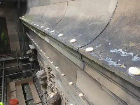 Optical Gel dishes installed along a curved building ledge
