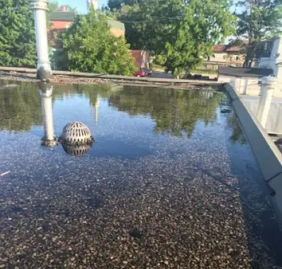 A deteriorating flat roof membrane